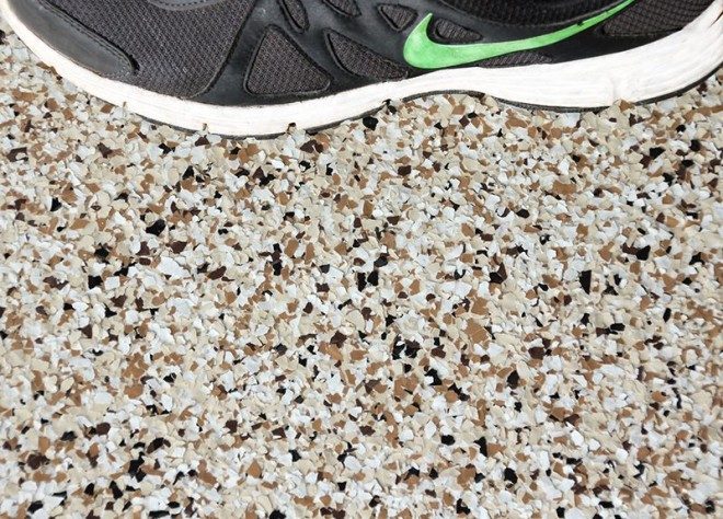 A close-up photo of a person's shoe walking across a Resin Vinyl floor.